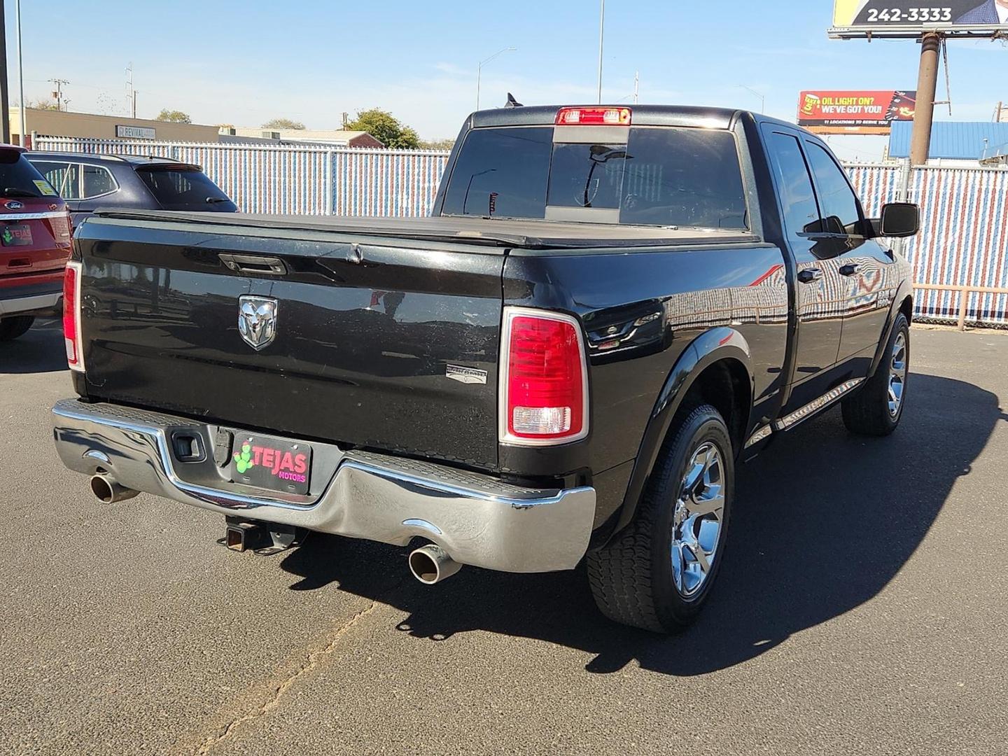 2017 BLACK Ram 1500 Laramie Quad Cab 4x2 6'4" Box (1C6RR6JT9HS) with an HEMI 5.7L V-8 variable valve control, regular unleaded, engine with cylinder deactivation and 395HP engine, located at 4110 Avenue Q, Lubbock, 79412, 33.556553, -101.855820 - 11/04/2025 KEY IN ENVELOPE GOD - Photo#1