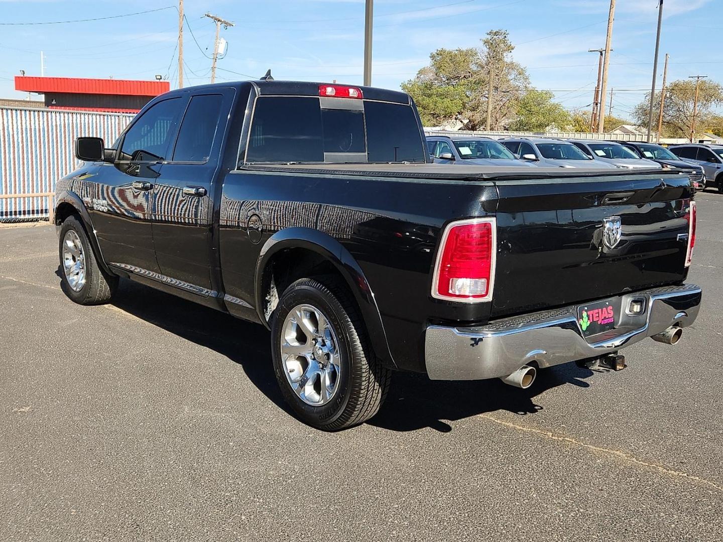 2017 BLACK Ram 1500 Laramie Quad Cab 4x2 6'4" Box (1C6RR6JT9HS) with an HEMI 5.7L V-8 variable valve control, regular unleaded, engine with cylinder deactivation and 395HP engine, located at 4110 Avenue Q, Lubbock, 79412, 33.556553, -101.855820 - 11/04/2025 KEY IN ENVELOPE GOD - Photo#2