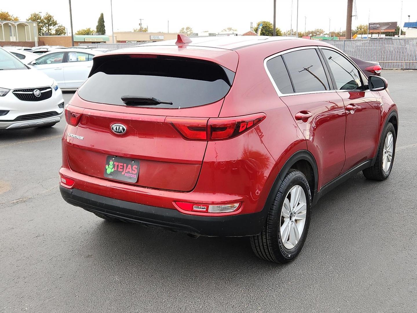 2018 RED Kia Sportage LX (KNDPMCAC0J7) with an Theta II 2.4L I-4 gasoline direct injection, DOHC, D-CVVT variable valve control, regular unleaded, engine with 181HP engine, located at 4110 Avenue Q, Lubbock, 79412, 33.556553, -101.855820 - 11/20/2025 key in envelope god - Photo#1