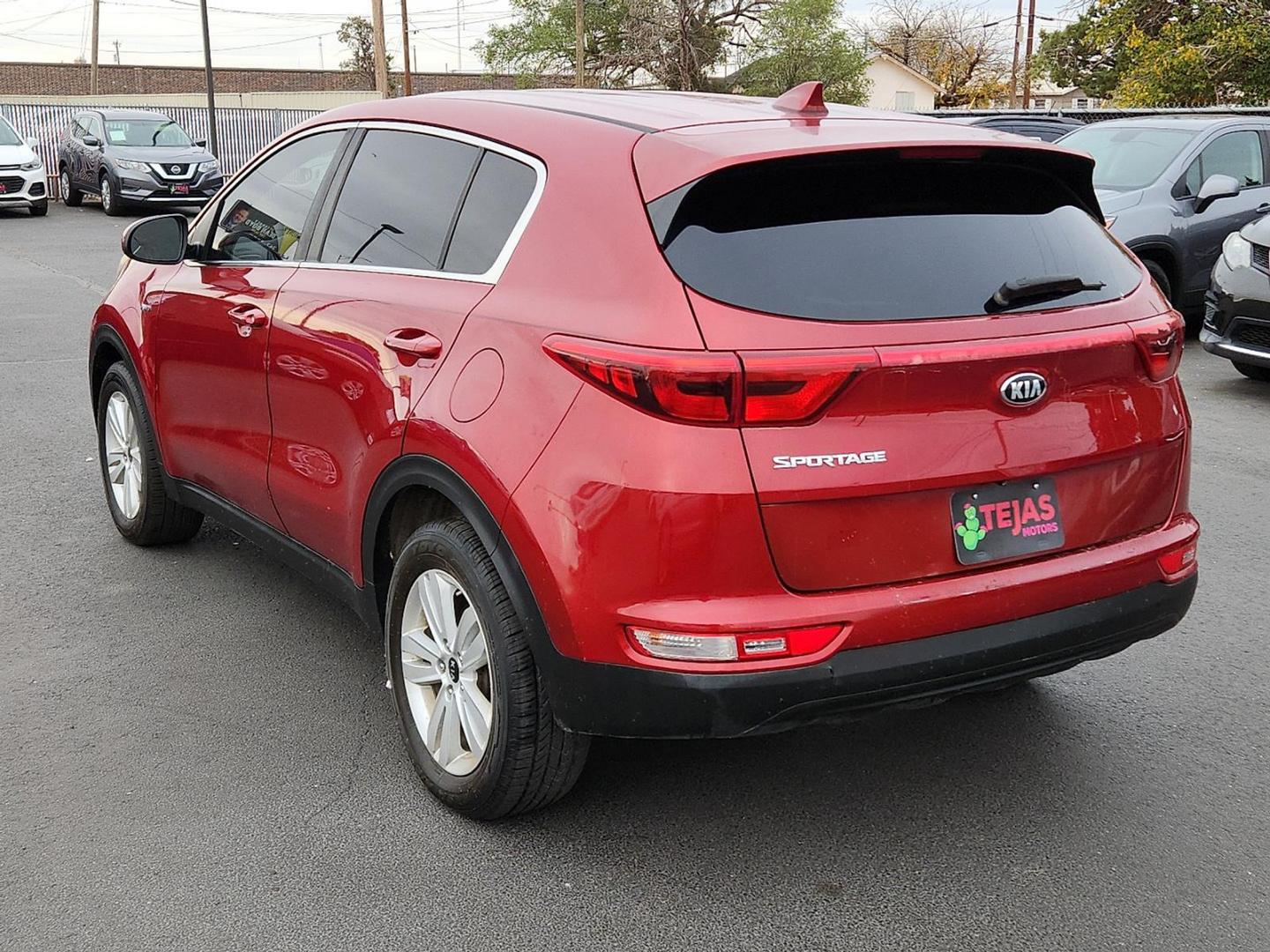 2018 RED Kia Sportage LX (KNDPMCAC0J7) with an Theta II 2.4L I-4 gasoline direct injection, DOHC, D-CVVT variable valve control, regular unleaded, engine with 181HP engine, located at 4110 Avenue Q, Lubbock, 79412, 33.556553, -101.855820 - 11/20/2025 key in envelope god - Photo#2