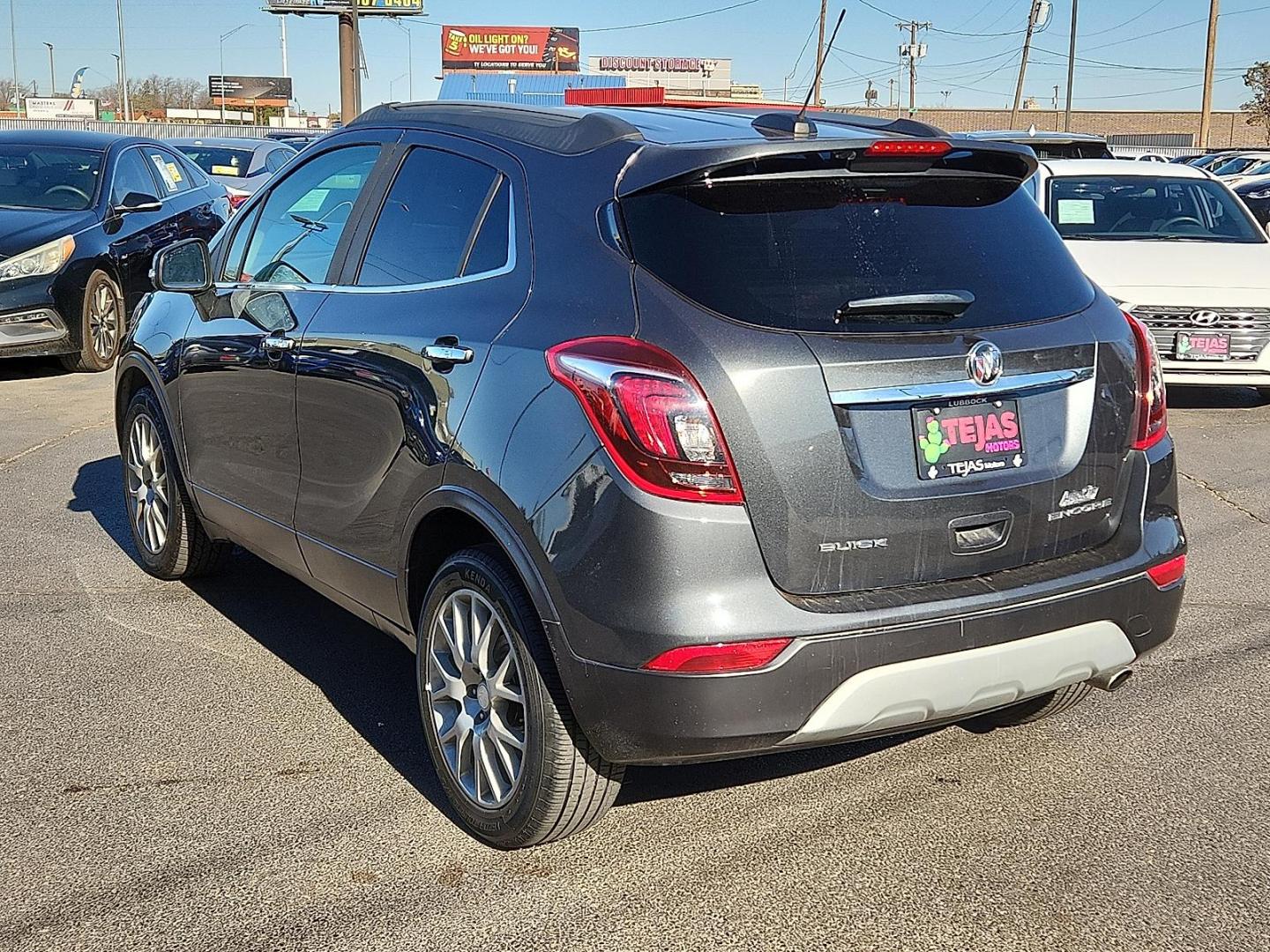 2018 Graphite Gray Metallic Buick Encore Sport Touring (KL4CJ1SB8JB) with an ECOTEC 1.4L I-4 DOHC, VVT variable valve control, intercooled turbo, regular unleaded, engine with 138HP engine, located at 4110 Avenue Q, Lubbock, 79412, 33.556553, -101.855820 - Photo#2