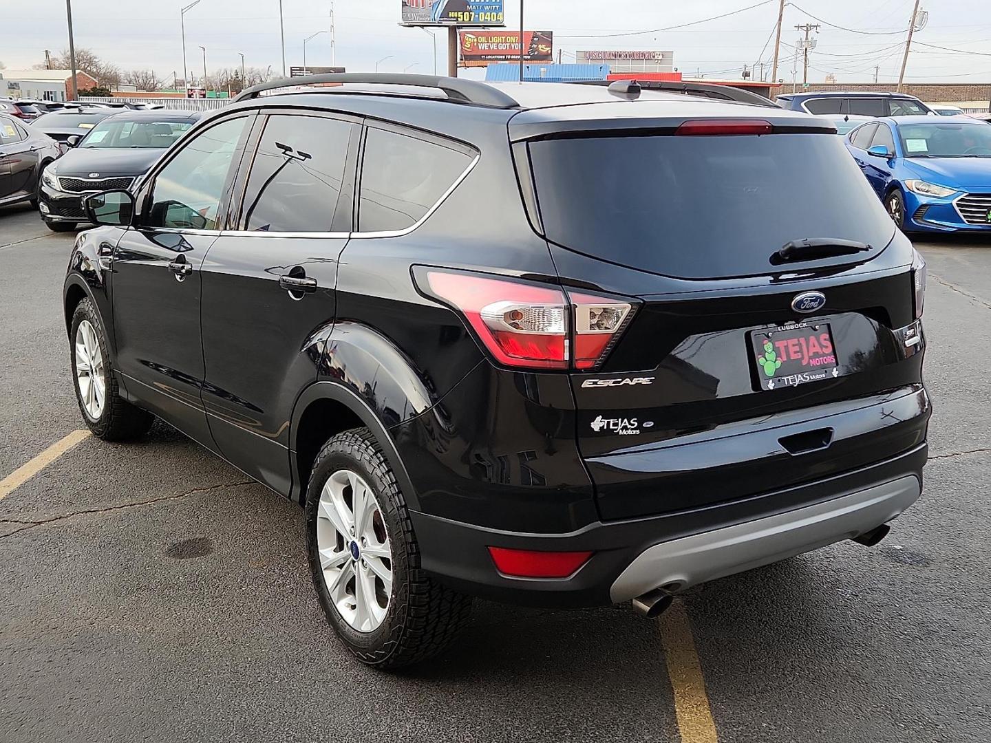 2018 BLACK Ford Escape SE (1FMCU0GD5JU) with an EcoBoost 1.5L I-4 gasoline direct injection, DOHC, variable valve control, intercooled turbo, regular unleaded, engine with 179HP engine, located at 4110 Avenue Q, Lubbock, 79412, 33.556553, -101.855820 - 01/15/2026 KEY IN ENVELOPE GOD - Photo#2