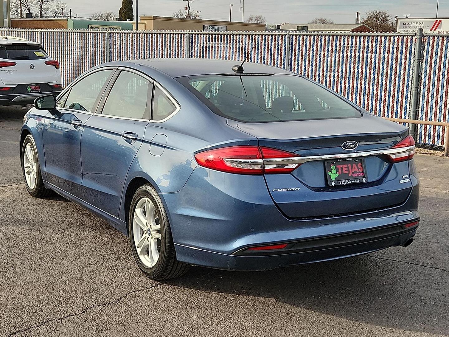 2018 BLUE Ford Fusion SE (3FA6P0HD9JR) with an EcoBoost 1.5L I-4 gasoline direct injection, DOHC, Ti-VCT variable valve control, intercooled turbo, regular unleaded, engine with 181HP engine, located at 4110 Avenue Q, Lubbock, 79412, 33.556553, -101.855820 - 02/11/2026 KEY IN ENVELOPE GOD - Photo#2