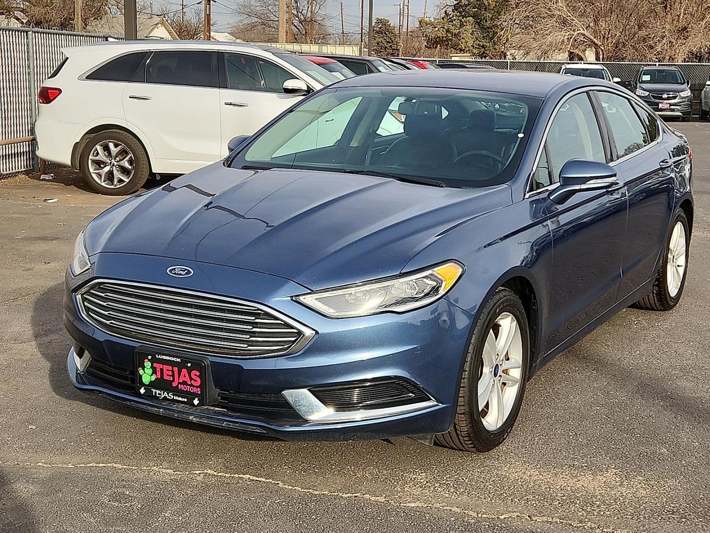 2018 BLUE Ford Fusion SE (3FA6P0HD9JR) with an EcoBoost 1.5L I-4 gasoline direct injection, DOHC, Ti-VCT variable valve control, intercooled turbo, regular unleaded, engine with 181HP engine, located at 4110 Avenue Q, Lubbock, 79412, 33.556553, -101.855820 - 02/11/2026 KEY IN ENVELOPE GOD - Photo#3