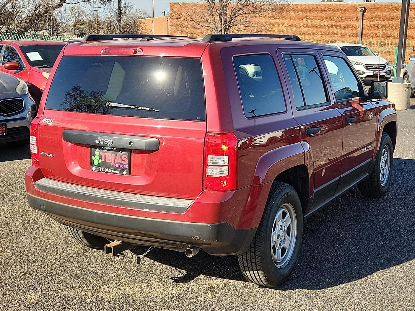 2016 RED Jeep Patriot Sport (1C4NJRBB0GD) with an 2.4L I-4 DOHC, variable valve control, regular unleaded, engine with 172HP engine, located at 4110 Avenue Q, Lubbock, 79412, 33.556553, -101.855820 - 02/11/2026 KEY IN ENVELOPE GOD - Photo#2