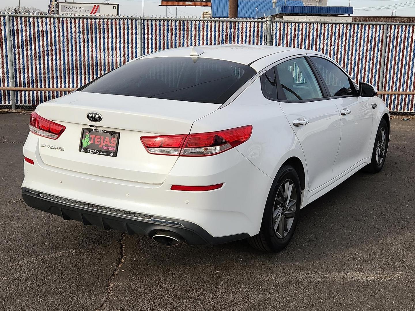 2019 WHITE Kia Optima LX (5XXGT4L32KG) with an Theta II 2.4L I-4 gasoline direct injection, DOHC, D-CVVT variable valve control, regular unleaded, engine with 185HP engine, located at 4110 Avenue Q, Lubbock, 79412, 33.556553, -101.855820 - 02/10/2026 KEY IN ENVELOPE GOD - Photo#1