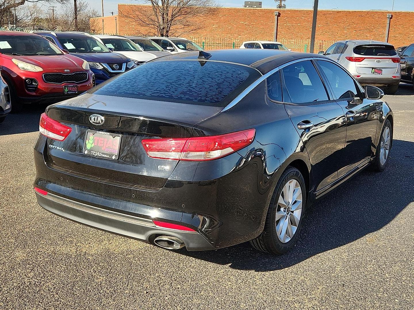 2018 BLACK Kia Optima EX (5XXGU4L39JG) with an Theta II 2.4L I-4 gasoline direct injection, DOHC, CVVT variable valve control, regular unleaded, engine with 185HP engine, located at 4110 Avenue Q, Lubbock, 79412, 33.556553, -101.855820 - 02/24/2026 KEY IN ENVELOPE GOD - Photo#1