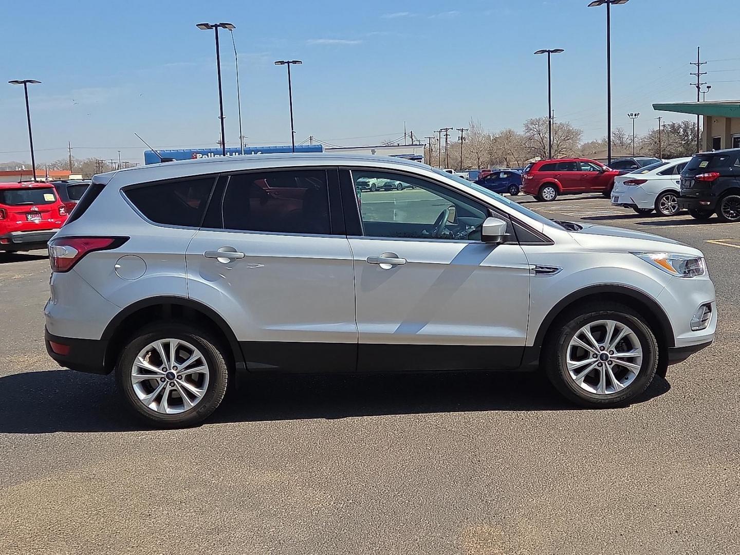 2017 Ingot Silver Metallic - UX /Charcoal Black - KB Ford Escape SE (1FMCU0GDXHU) with an EcoBoost 1.5L I-4 gasoline direct injection, DOHC, variable valve control, intercooled turbo, regular unleaded, engine with 179HP engine, located at 4110 Avenue Q, Lubbock, 79412, 33.556553, -101.855820 - Photo#1