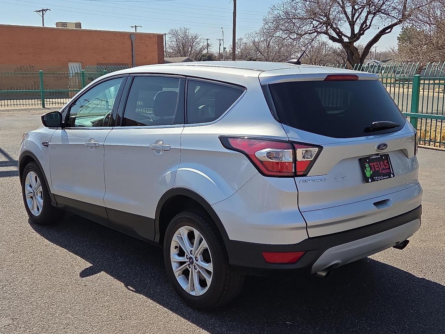 2017 Ingot Silver Metallic - UX /Charcoal Black - KB Ford Escape SE (1FMCU0GDXHU) with an EcoBoost 1.5L I-4 gasoline direct injection, DOHC, variable valve control, intercooled turbo, regular unleaded, engine with 179HP engine, located at 4110 Avenue Q, Lubbock, 79412, 33.556553, -101.855820 - Photo#3