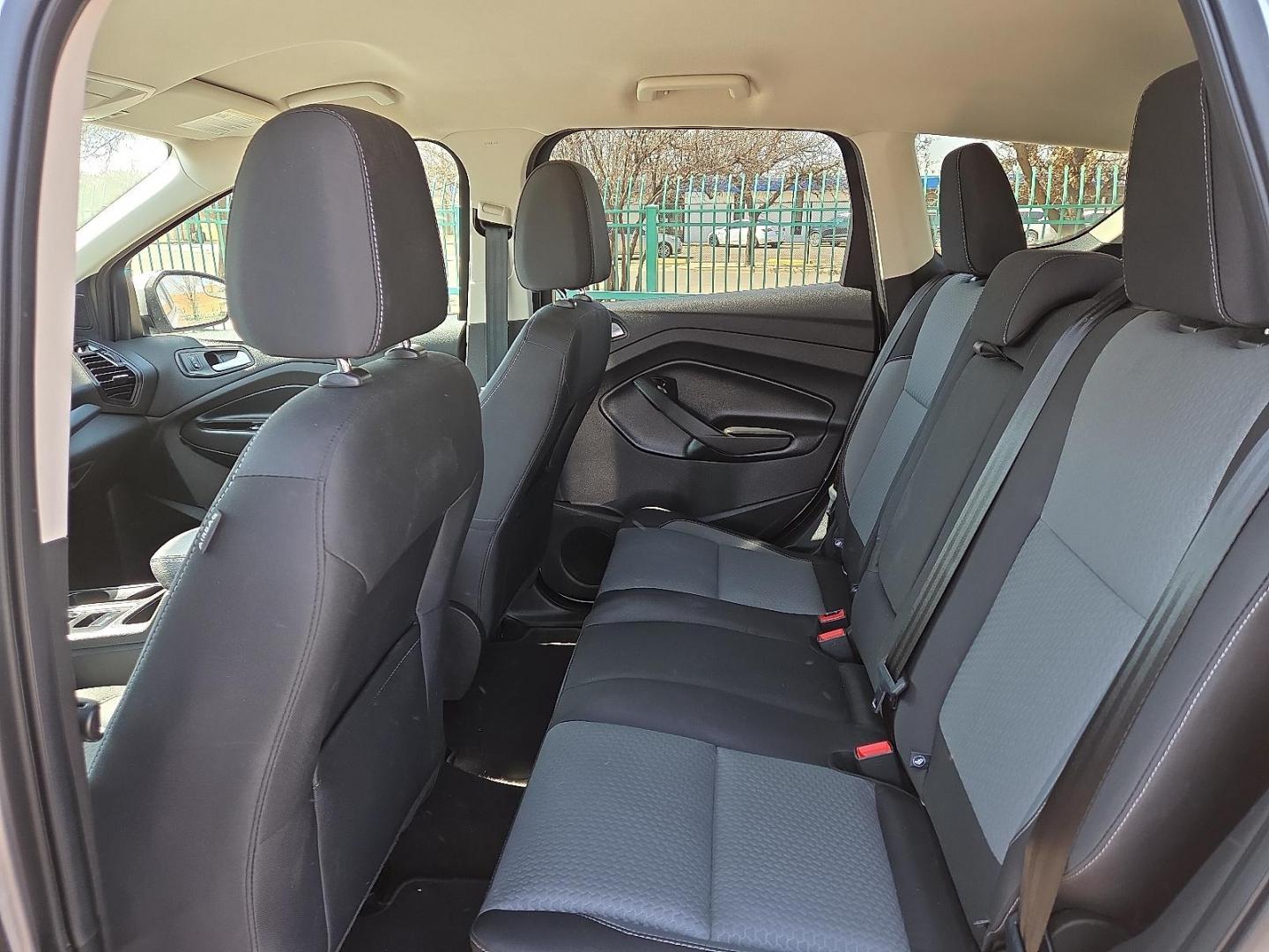 2017 Ingot Silver Metallic - UX /Charcoal Black - KB Ford Escape SE (1FMCU0GDXHU) with an EcoBoost 1.5L I-4 gasoline direct injection, DOHC, variable valve control, intercooled turbo, regular unleaded, engine with 179HP engine, located at 4110 Avenue Q, Lubbock, 79412, 33.556553, -101.855820 - Photo#7