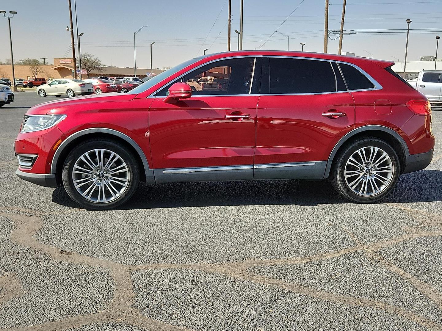 2016 Ruby Red Metallic Tinted Clearcoat - RR /Ebony - BE Lincoln MKX Reserve (2LMTJ8LR4GB) with an 3.7L V-6 DOHC, variable valve control, regular unleaded, engine with 303HP engine, located at 4110 Avenue Q, Lubbock, 79412, 33.556553, -101.855820 - Photo#1