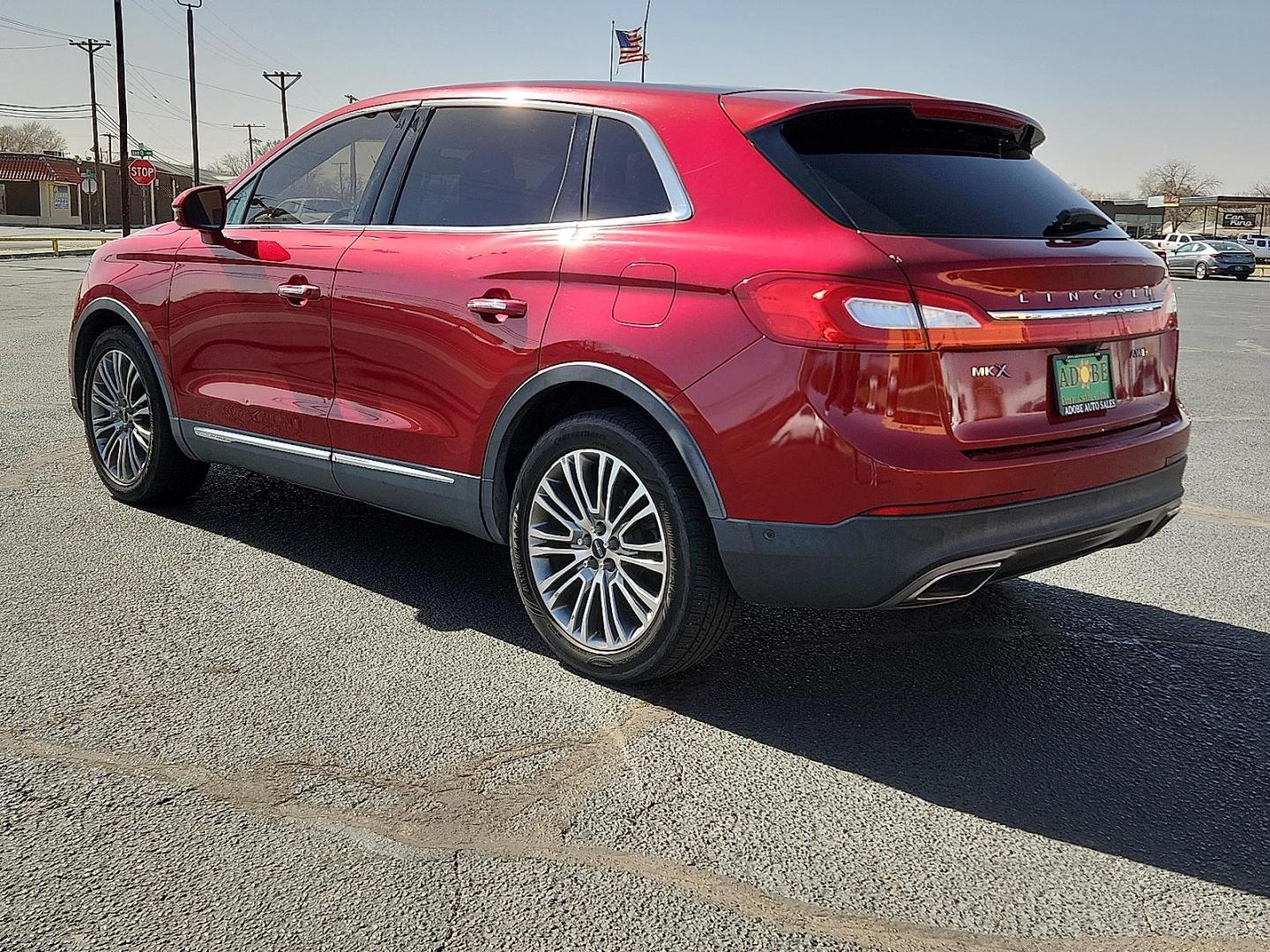 2016 Ruby Red Metallic Tinted Clearcoat - RR /Ebony - BE Lincoln MKX Reserve (2LMTJ8LR4GB) with an 3.7L V-6 DOHC, variable valve control, regular unleaded, engine with 303HP engine, located at 4110 Avenue Q, Lubbock, 79412, 33.556553, -101.855820 - Photo#2