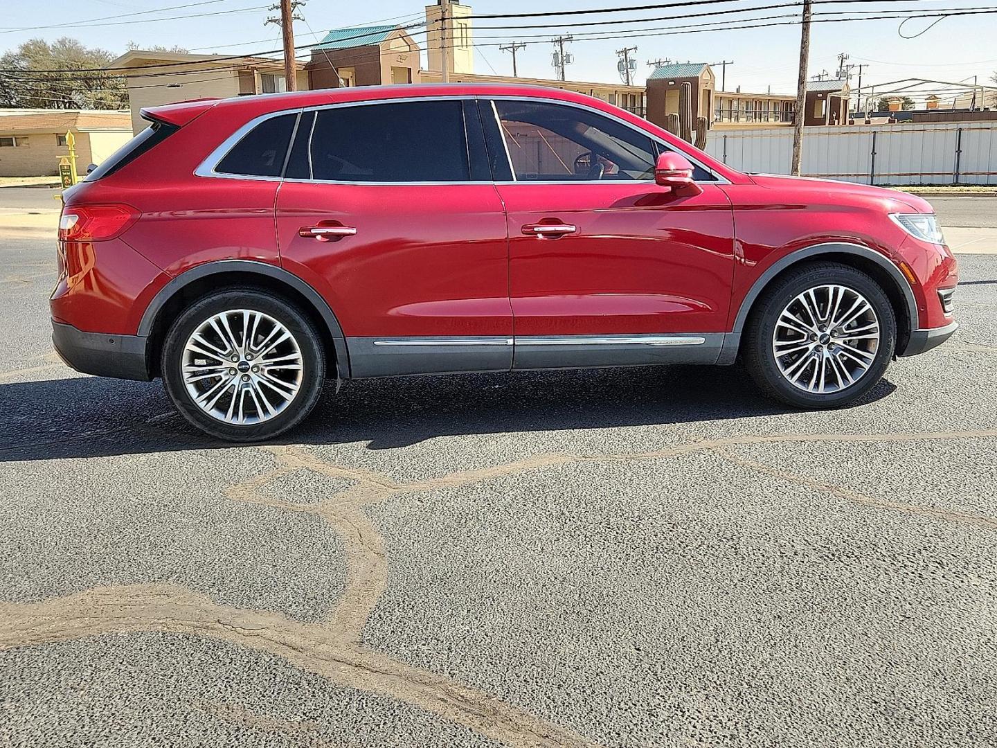 2016 Ruby Red Metallic Tinted Clearcoat - RR /Ebony - BE Lincoln MKX Reserve (2LMTJ8LR4GB) with an 3.7L V-6 DOHC, variable valve control, regular unleaded, engine with 303HP engine, located at 4110 Avenue Q, Lubbock, 79412, 33.556553, -101.855820 - Photo#4