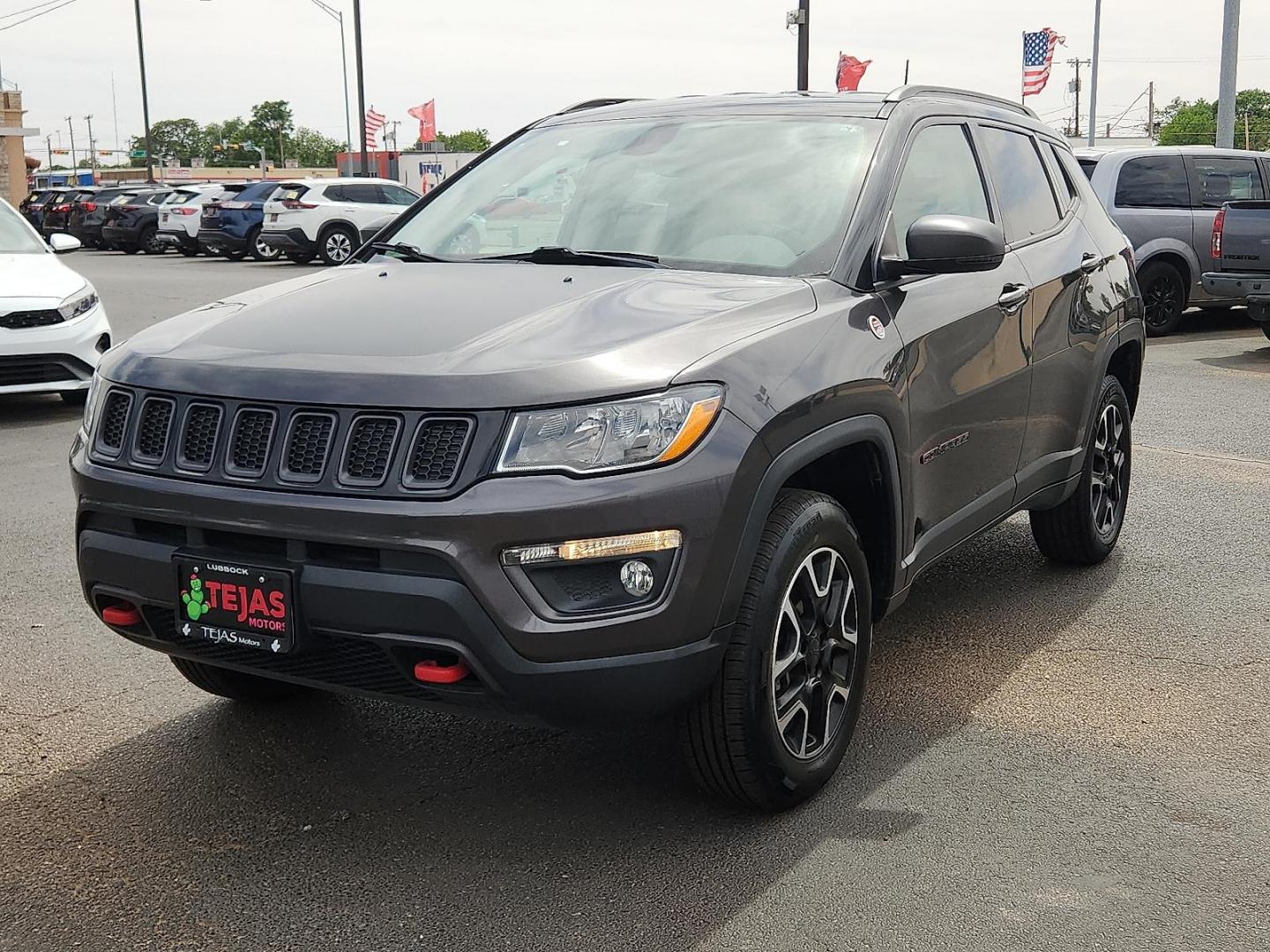2020 GRAY /Ruby Red/Black - XC Jeep Compass Trailhawk 4x4 (3C4NJDDB8LT) with an 2.4L I-4 variable valve control, regular unleaded, engine with 180HP engine, located at 4110 Avenue Q, Lubbock, 79412, 33.556553, -101.855820 - 04/23/2026 KEY IN ENVELOPE GOD - Photo#1