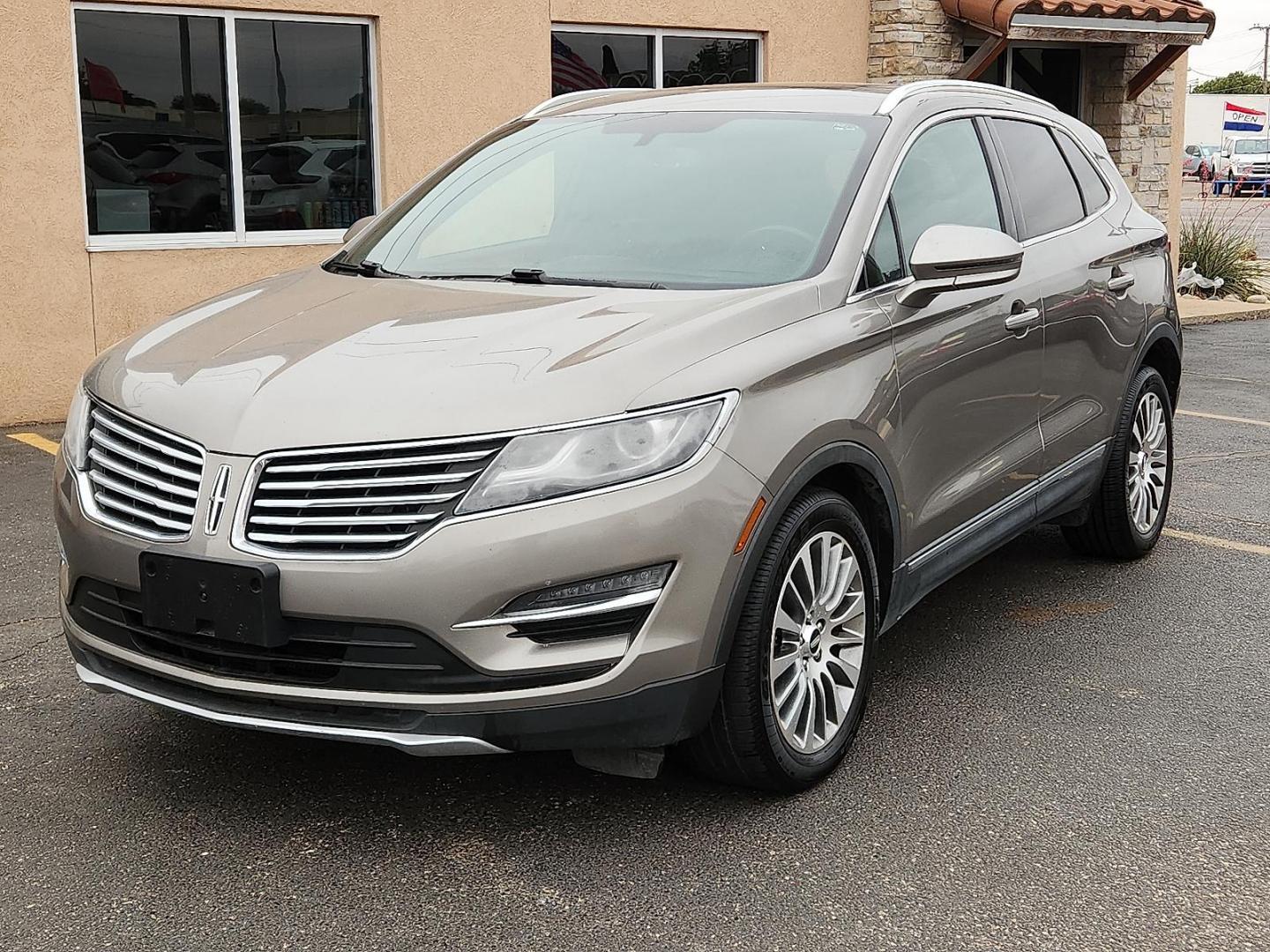 2017 GOLD /Ebony - 42 Lincoln MKC Reserve (5LMCJ3C90HU) with an 2L I-4 gasoline direct injection, DOHC, variable valve control, intercooled turbo, premium unleaded, engine with 240HP engine, located at 4110 Avenue Q, Lubbock, 79412, 33.556553, -101.855820 - 04/28/2026 KEY IN ENVELOPE GOD - Photo#1