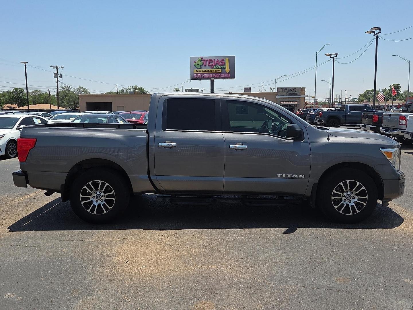 2021 Gun Metallic - KAD /Black - G Nissan TITAN Crew Cab SV 4x2 (1N6AA1EFXMN) with an Endurance 5.6L V-8 gasoline direct injection, DOHC, variable valve control, premium unleaded, engine with 400HP engine, located at 4110 Avenue Q, Lubbock, 79412, 33.556553, -101.855820 - 06/06/2026 KEY IN ENVELOPE GOD - Photo#1