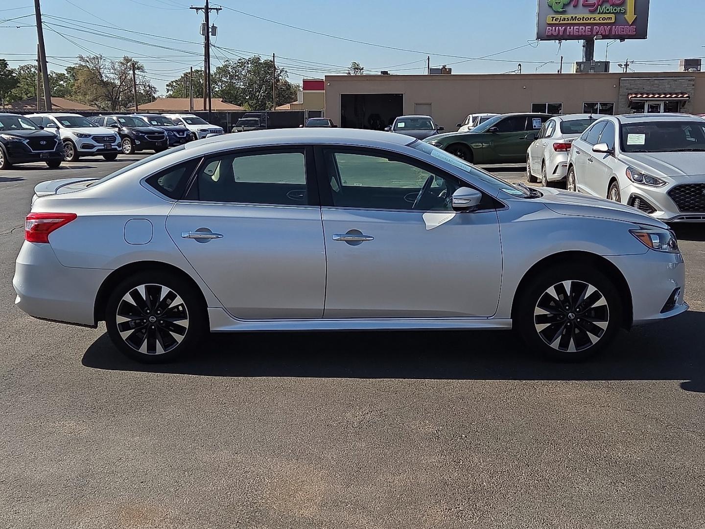 2017 Brilliant Silver - K23 /Charcoal - G Nissan Sentra SR (3N1AB7AP5HY) with an 1.8L I-4 DOHC, variable valve control, regular gasoline, engine with 124HP engine, located at 4110 Avenue Q, Lubbock, 79412, 33.556553, -101.855820- Photo#1